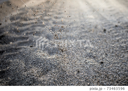 Road of small stones close-up with a scattering of stones in the sun at sunset. Road of small stones close-up with a scattering of stones in the sun at sunset. 73463596