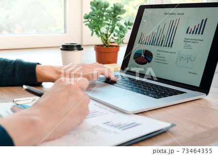 close up. man using a laptop to analyze financial charts. 73464355