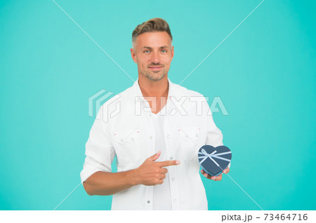 Look here. Handsome man buy gift for girlfriend. Valentines day 73464716