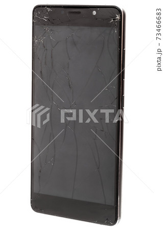 Broken glass of smartphone screen with a crashed display from shock, Isolated on a white background. Broken glass of smartphone screen with a crashed display from shock, Isolated on a white background. 73466683