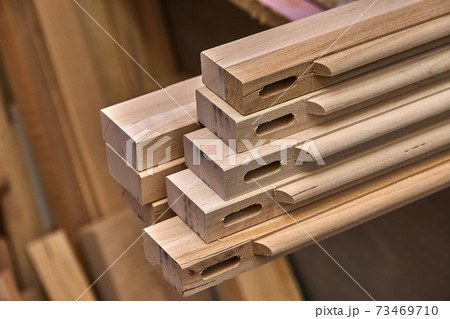 Joinery. Wooden cabinet doors. Wooden frame. Home library with classic design. Wooden furniture manufacturing process Joinery. Wooden cabinet doors. Wooden frame. Home library with classic design. Wooden furniture manufacturing process 73469710