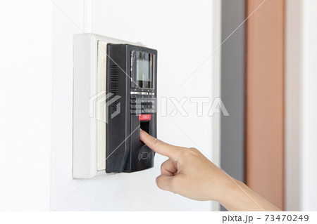 Finger print scan, Male employees press sensors to record company attendance time and after work, Time Recorder Attendance - Out work, Encryption for identity verification or electronic signing Finger print scan, Male employees press sensors to record company attendance time and after work, Time Recorder Attendance - Out work, Encryption for identity verification or electronic signing 73470249