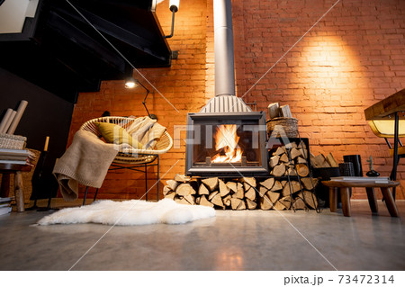 Burning fireplace with firewood at home 73472314