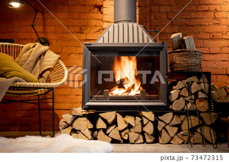 Burning fireplace with firewood at home 73472315