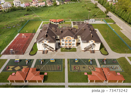Aerial view of new prescool building in residential rural area. Aerial view of new prescool building in residential rural area. 73473242