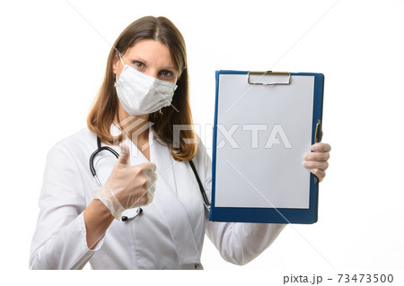 Doctor showing a tablet with a blank sheet of paper and thumb up Doctor showing a tablet with a blank sheet of paper and thumb up 73473500