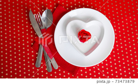 Romantic decoration of holiday table - Red background 73473879