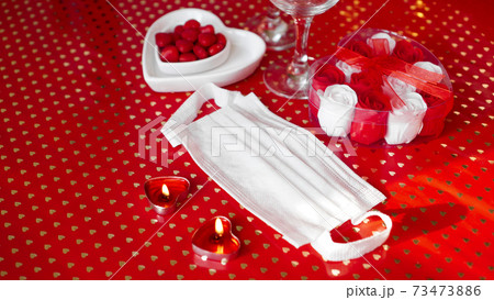 Valentines day concept table. romantic dinner with medical mask Valentines day concept table. romantic dinner with medical mask 73473886