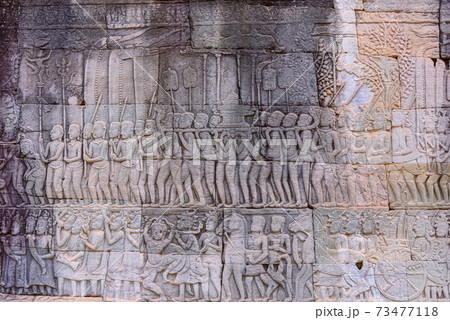 Stone carvings on the walls of the Bayon Temple in Angkor Thom 73477118