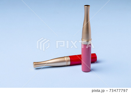 Lip make up product on pink background 73477797