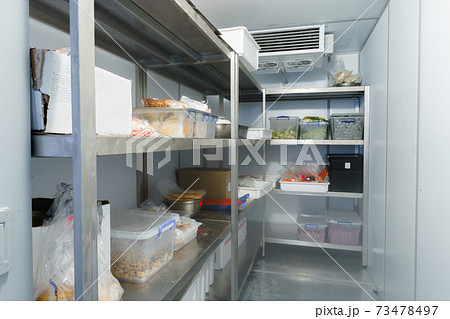 Refrigerator chamber with steel shelves in a restaurant 73478497