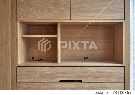 Wooden cupboard with drawers and empty shelves. Modern furniture 73480365