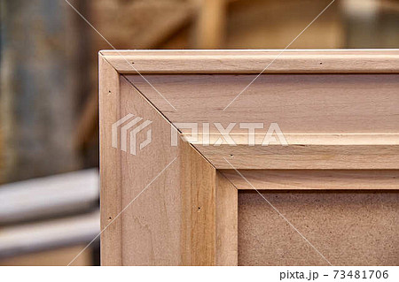 Joinery. Wooden mirror frame. Furniture manufacture. Close-up Joinery. Wooden mirror frame. Furniture manufacture. Close-up 73481706