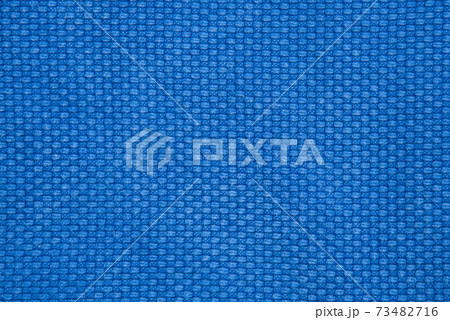 The texture of a cotton kimono for judo classes. Blue fabric close-up. The view from the top. The texture of a cotton kimono for judo classes. Blue fabric close-up. The view from the top. 73482716