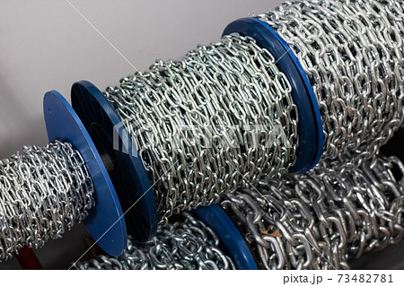 Large chain wound into a coil close up Large chain wound into a coil close up 73482781