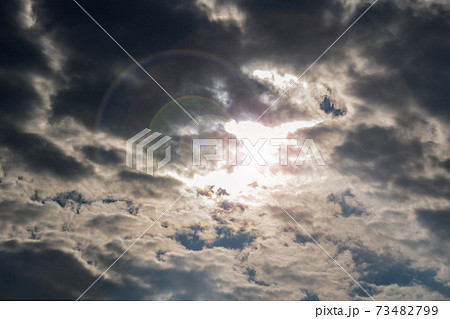 The light of the sun through the thick dark clouds 73482799