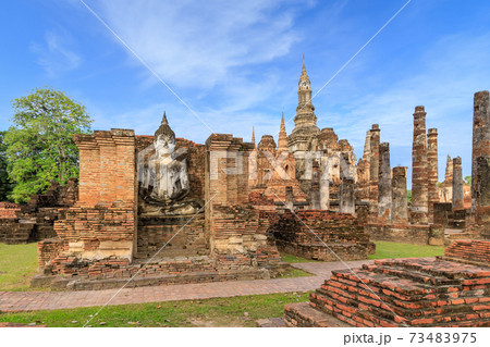 Buddha statue and pagoda Wat Mahathat temple, Sukhothai Historical Park, Thailand Buddha statue and pagoda Wat Mahathat temple, Sukhothai Historical Park, Thailand 73483975