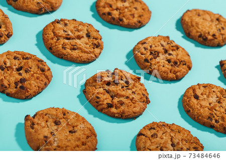 Oatmeal cookies on a blue background with a pattern in the form of a pattern. 73484646