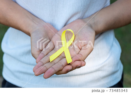Suicide prevention, Sarcoma, bone, bladder, Childhood cancer Awareness month, Yellow Ribbon for supporting people living and illness. children Healthcare and World cancer day concept Suicide prevention, Sarcoma, bone, bladder, Childhood cancer Awareness month, Yellow Ribbon for supporting people living and illness. children Healthcare and World cancer day concept 73485343