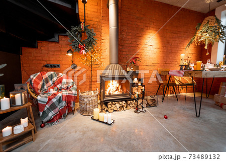 Festively decorated fireplace area of the house 73489132