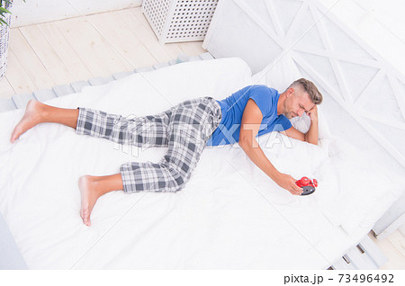 Sleeping guy at home. Sleep disorders. Good and healthy Sleeping guy at home. Sleep disorders. Good and healthy 73496492