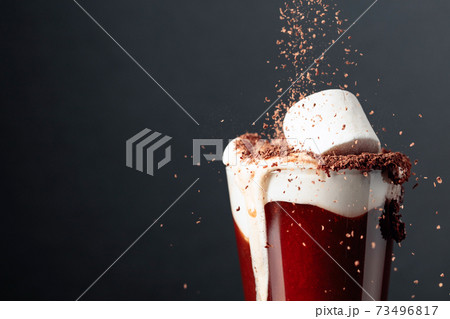 Hot chocolate with marshmallows sprinkled with chocolate crumbs. Hot chocolate with marshmallows sprinkled with chocolate crumbs. 73496817