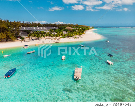 Luxury beach with Le Morne mountain in Mauritius. Beach with palms and clear ocean. Aerial view 73497045
