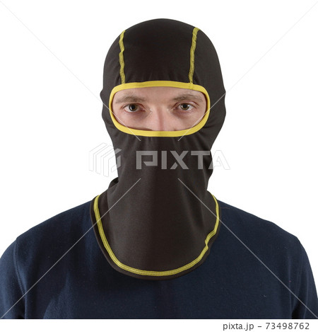 brunette man in a blue shirt with a black balaclava with yellow edging 73498762