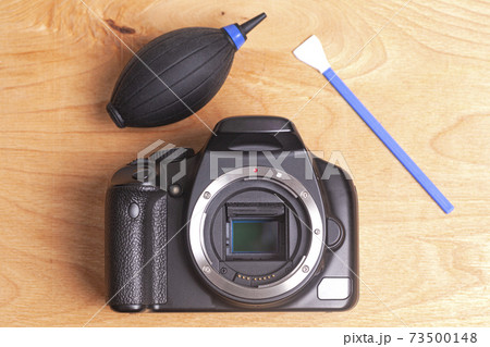 Professional cleaning of camera with swab and air dust blower Professional cleaning of camera with swab and air dust blower 73500148