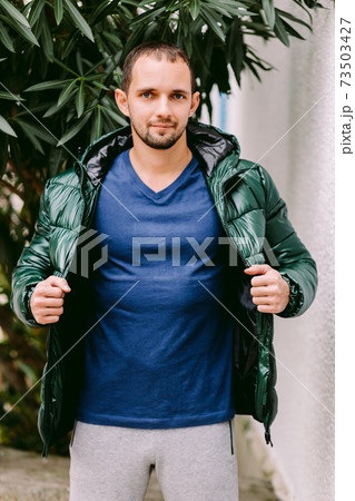 man wearing blue t-shirt mockup and jacket outdoors man wearing blue t-shirt mockup and jacket outdoors 73503427