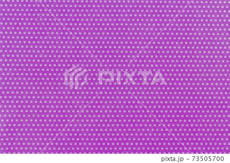 Textile background, purple violet with a print in white polka dots.  73505700