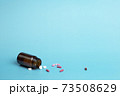 Various medicine. Different colour capsule and pill bottle 73508629