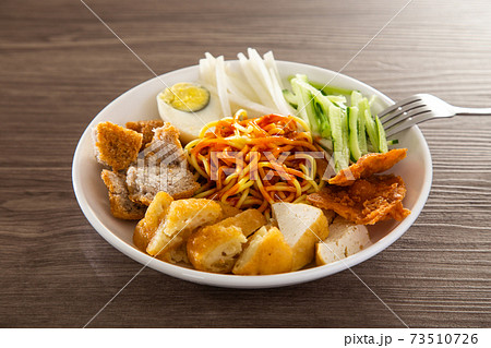 Mee Rojak is Malaysia Indian food of noodle with peanut sauce. Mee Rojak is Malaysia Indian food of noodle with peanut sauce. 73510726