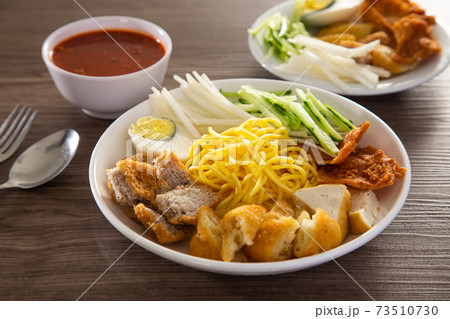Mee Rojak is Malaysia Indian food of noodle with peanut sauce. Mee Rojak is Malaysia Indian food of noodle with peanut sauce. 73510730
