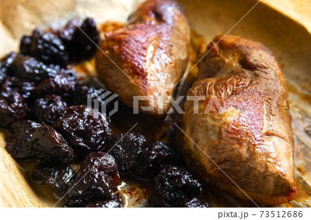 Roast duck breast with plums prepared closeup Roast duck breast with plums prepared closeup 73512686