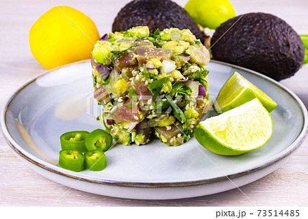 Seafood tuna fish ceviche salad avocado, lime, hot chili pepper, red onion, cilantro, sesame seeds Seafood tuna fish ceviche salad avocado, lime, hot chili pepper, red onion, cilantro, sesame seeds 73514485