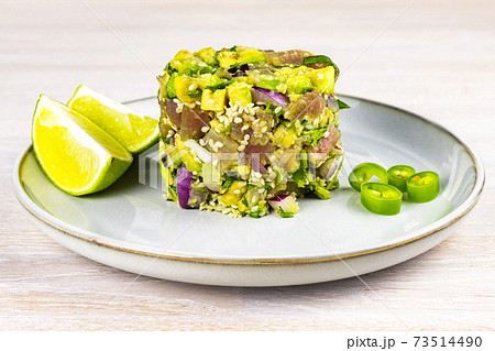 Seafood tuna fish ceviche salad avocado, lime, hot chili pepper, red onion, cilantro, sesame seeds Seafood tuna fish ceviche salad avocado, lime, hot chili pepper, red onion, cilantro, sesame seeds 73514490