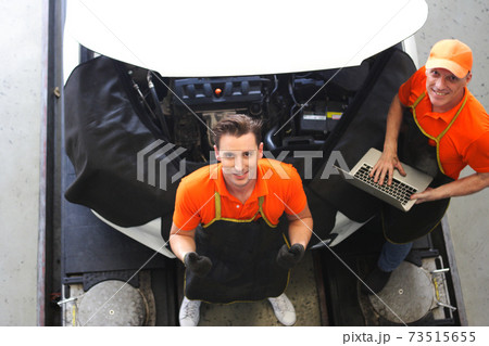 car mechanic use notebook computers to check engine and service maintenance of industrial to engine repair, for transport automobile automotive , top view image car mechanic use notebook computers to check engine and service maintenance of industrial to engine repair, for transport automobile automotive , top view image 73515655