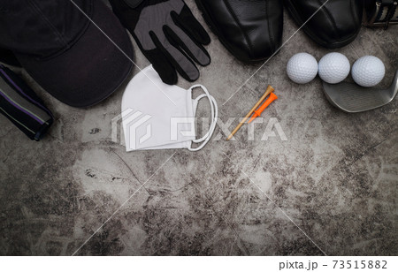 golf ball and accessories on floor 73515882