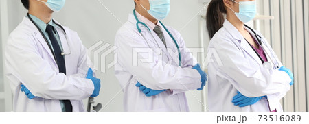Laboratory research. Team work Scientists  study data and evaluating microscope success. they are doing research with dropper chemical testing life science and find vaccine for covid 19 73516089