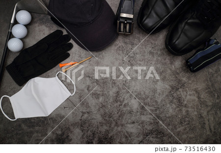 golf ball and accessories on floor 73516430