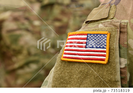 American Soldiers and Flag of USA on soldiers arm. US Army. Veterans Day 73518319