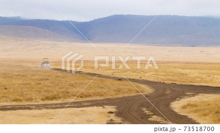 Dirt road on Ngorongoro crater, Tanzania landscape Dirt road on Ngorongoro crater, Tanzania landscape 73518700