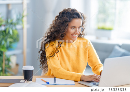 woman working on laptop at home. 73523333