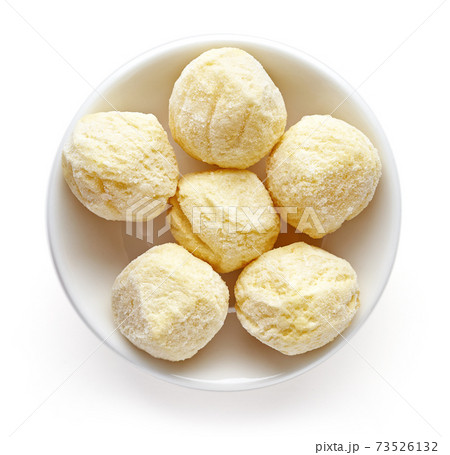 Bowl of frozen potato balls isolated on white, from above 73526132