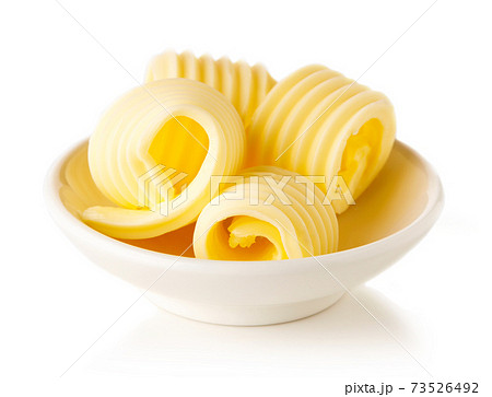 Butter curls isolated on white background 73526492