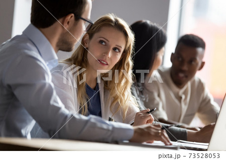 Young female employee discussing project ideas with male leader. Young female employee discussing project ideas with male leader. 73528053