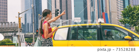 Taxi cab mobile phone app Asian business woman walking on street hailing a car for a ride using smartphone panoramic banner. City commuter lifestyle Taxi cab mobile phone app Asian business woman walking on street hailing a car for a ride using smartphone panoramic banner. City commuter lifestyle 73528288