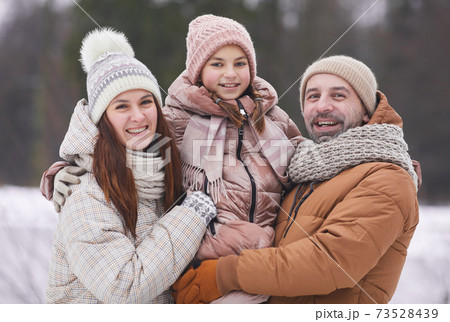 Happy Family Portrait Outdoors in Winter Happy Family Portrait Outdoors in Winter 73528439