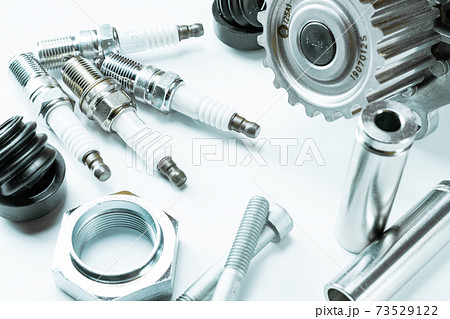 Spark plugs. Auto motor mechanic spare or automotive piece on white background. Set of new metal car part. Repair and vehicle service. 73529122